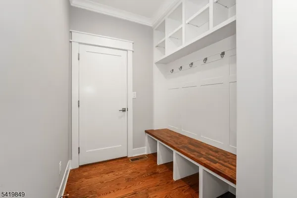 a view of an empty room with stairs