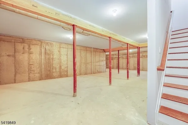 a aerial view of a house with a yard table and chairs