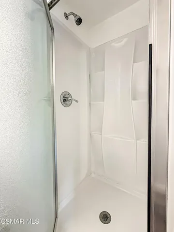 a view of a hallway with wooden floor and entryway