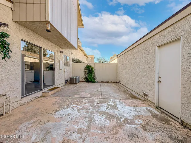 a view of a backyard of the house