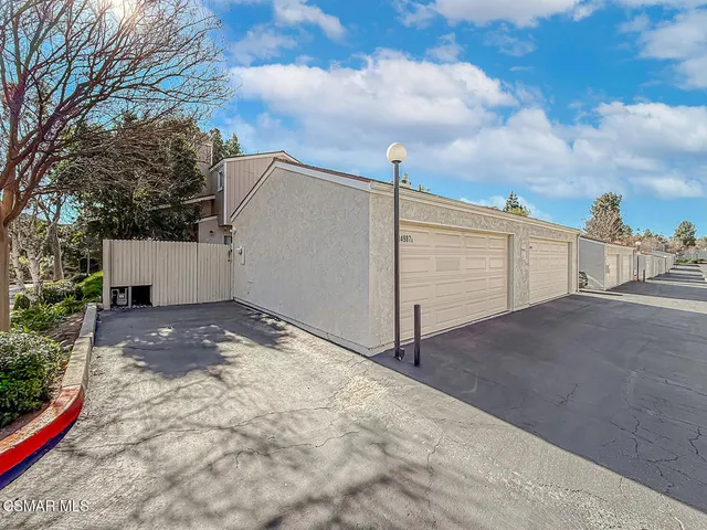 a garden view with a fountain