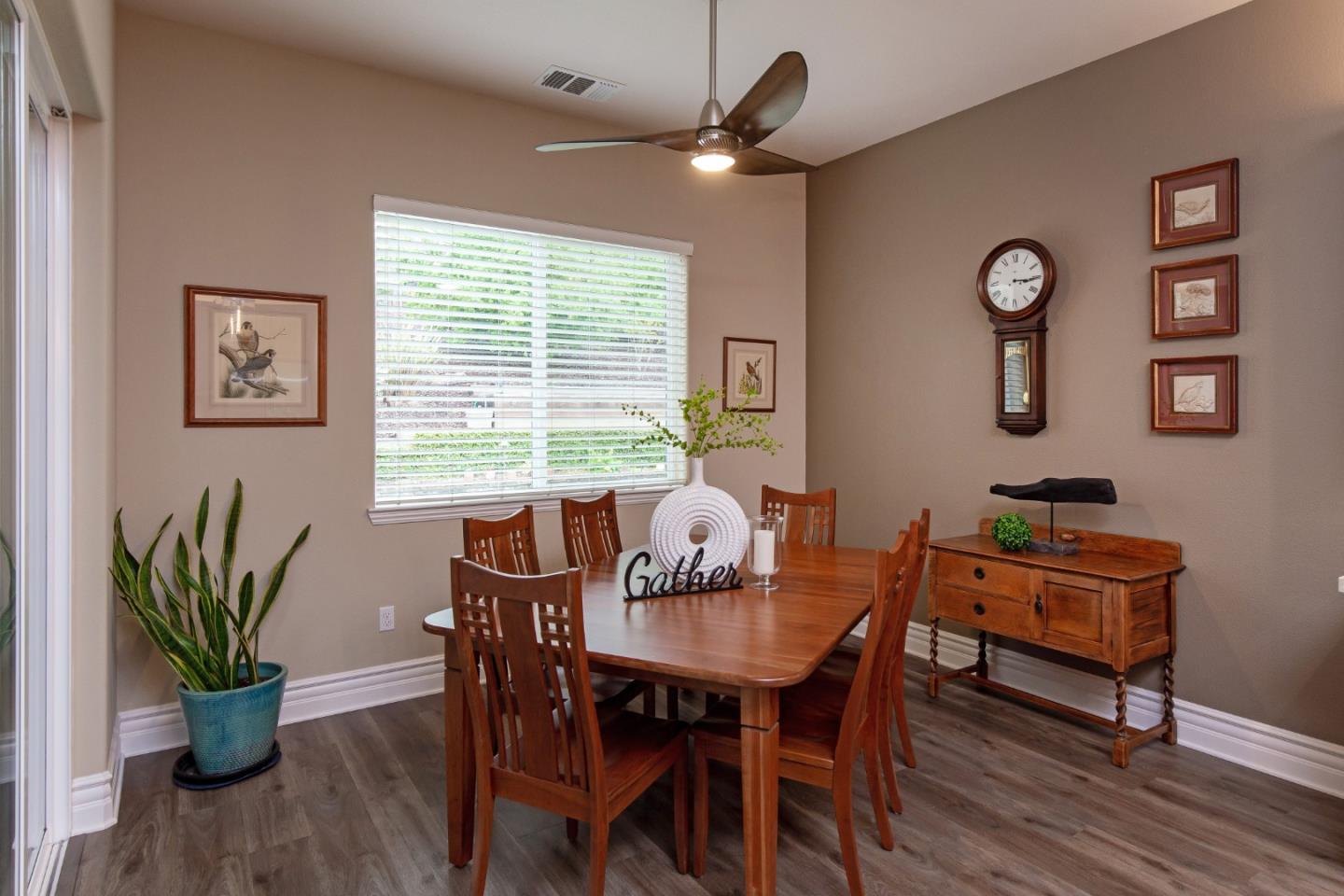 7217 Pitlochry Drive Gilroy, CA 95020 - Photo 12 of 66 a view of a dining room with furniture window and wooden floor
