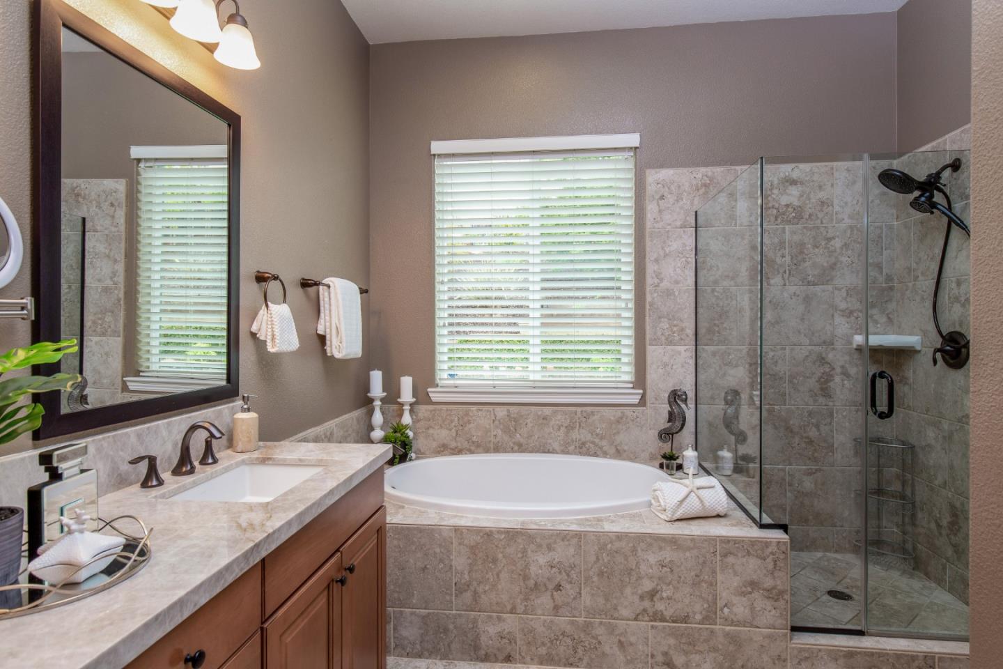 7217 Pitlochry Drive Gilroy, CA 95020 - Photo 17 of 66 a bath tub sitting next to a bathroom sink