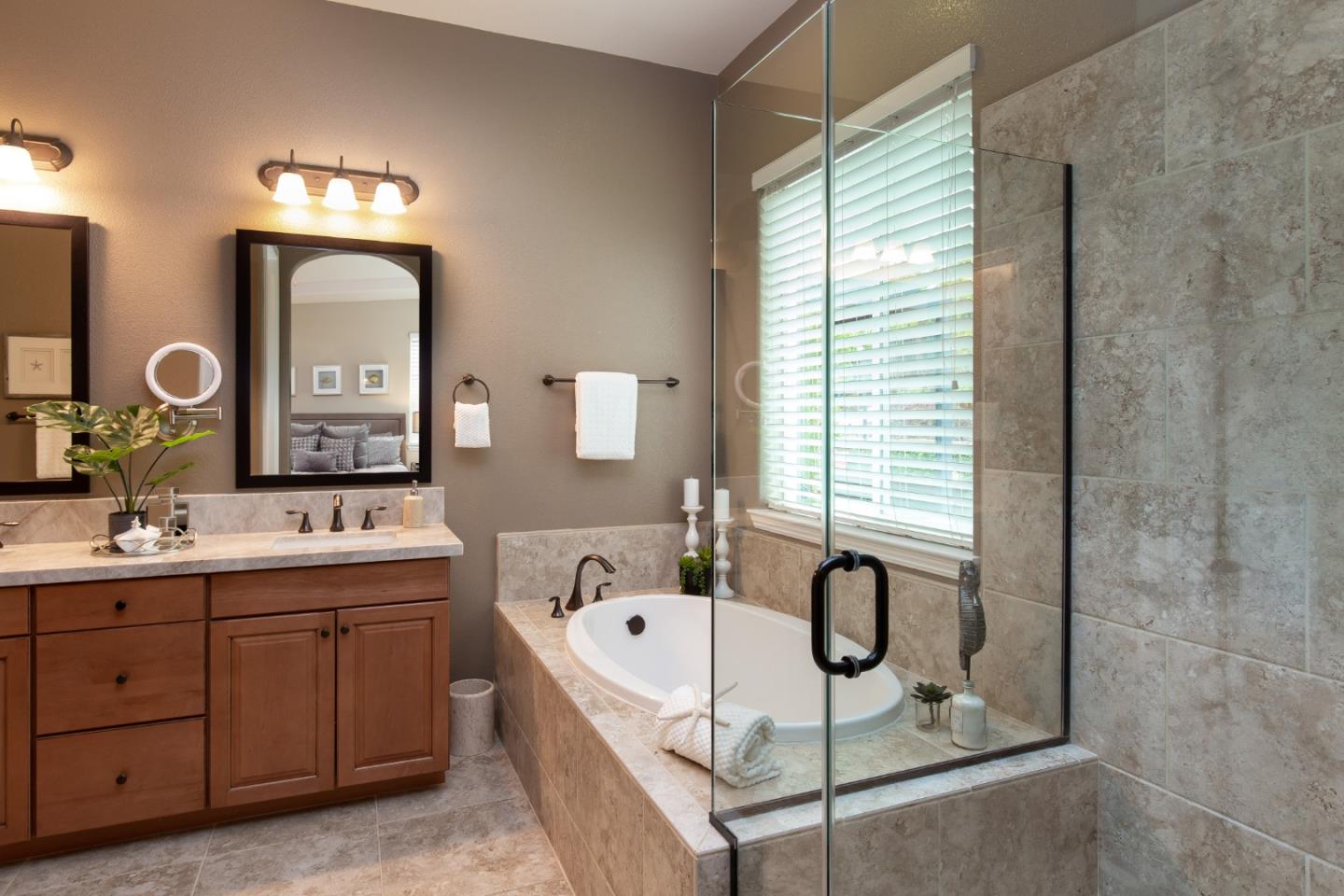 7217 Pitlochry Drive Gilroy, CA 95020 - Photo 18 of 66 a bathroom with a double vanity sink mirror and bathtub