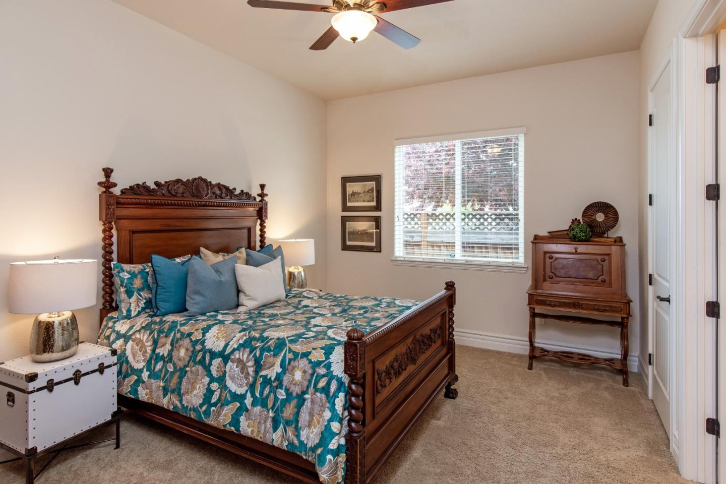 7217 Pitlochry Drive Gilroy, CA 95020 - Photo 22 of 66 a bedroom with a bed and a chandelier