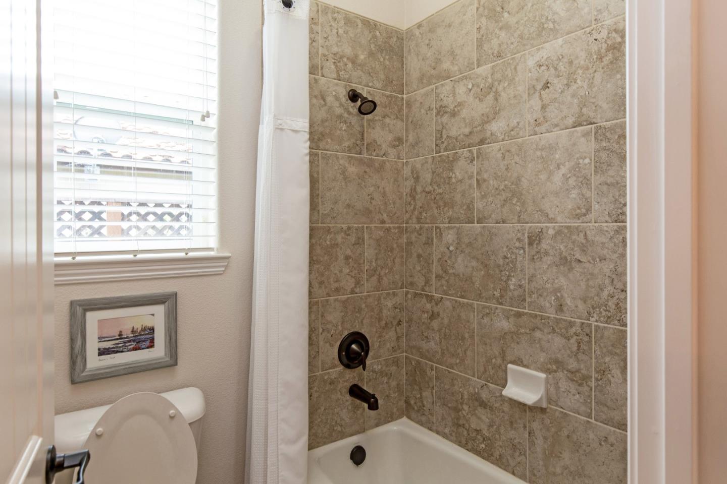 7217 Pitlochry Drive Gilroy, CA 95020 - Photo 23 of 66 a bathroom with a shower a toilet and a shower