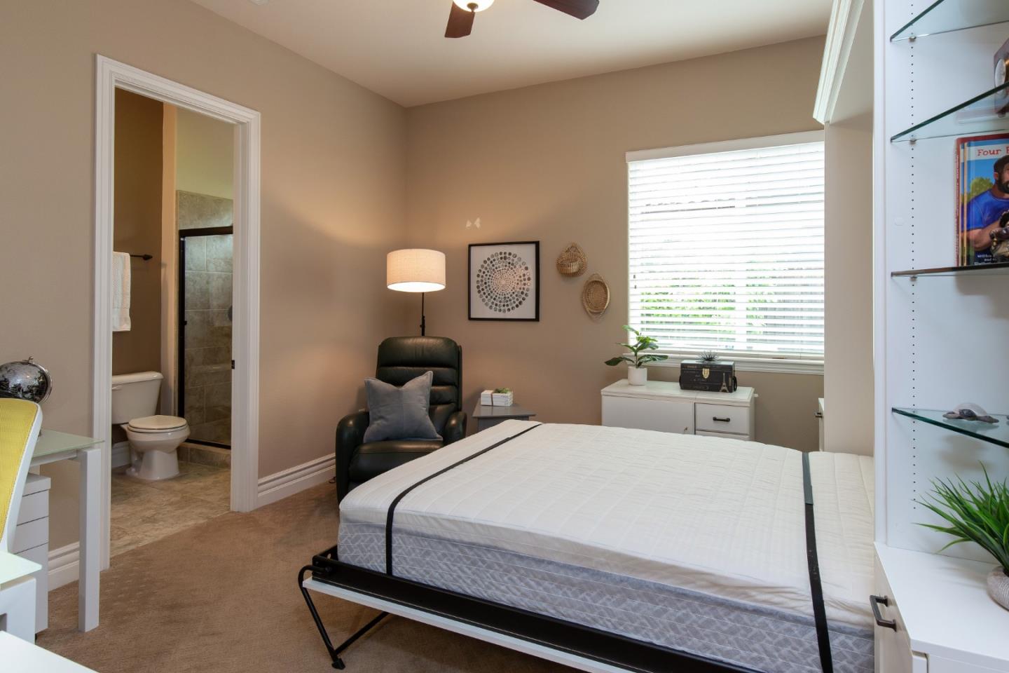 7217 Pitlochry Drive Gilroy, CA 95020 - Photo 25 of 66 a bedroom with a bed a mirror and a window