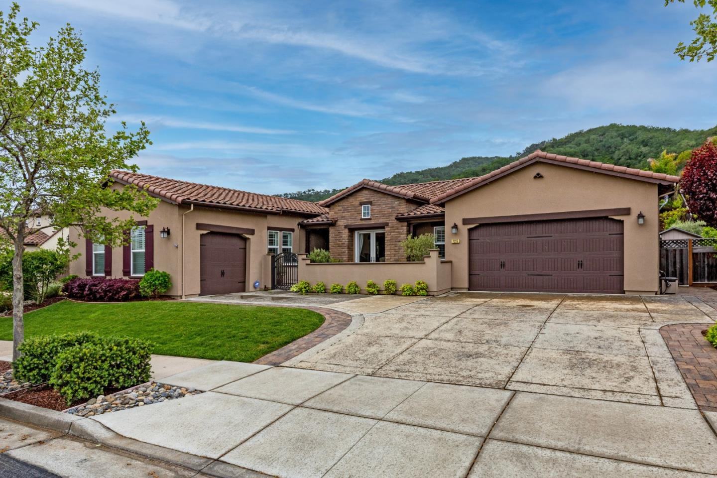 7217 Pitlochry Drive Gilroy, CA 95020 - Photo 3 of 66 a front view of a house with a garden