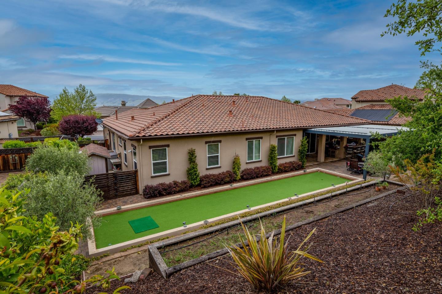 7217 Pitlochry Drive Gilroy, CA 95020 - Photo 64 of 66 a front view of a house with a garden and plants