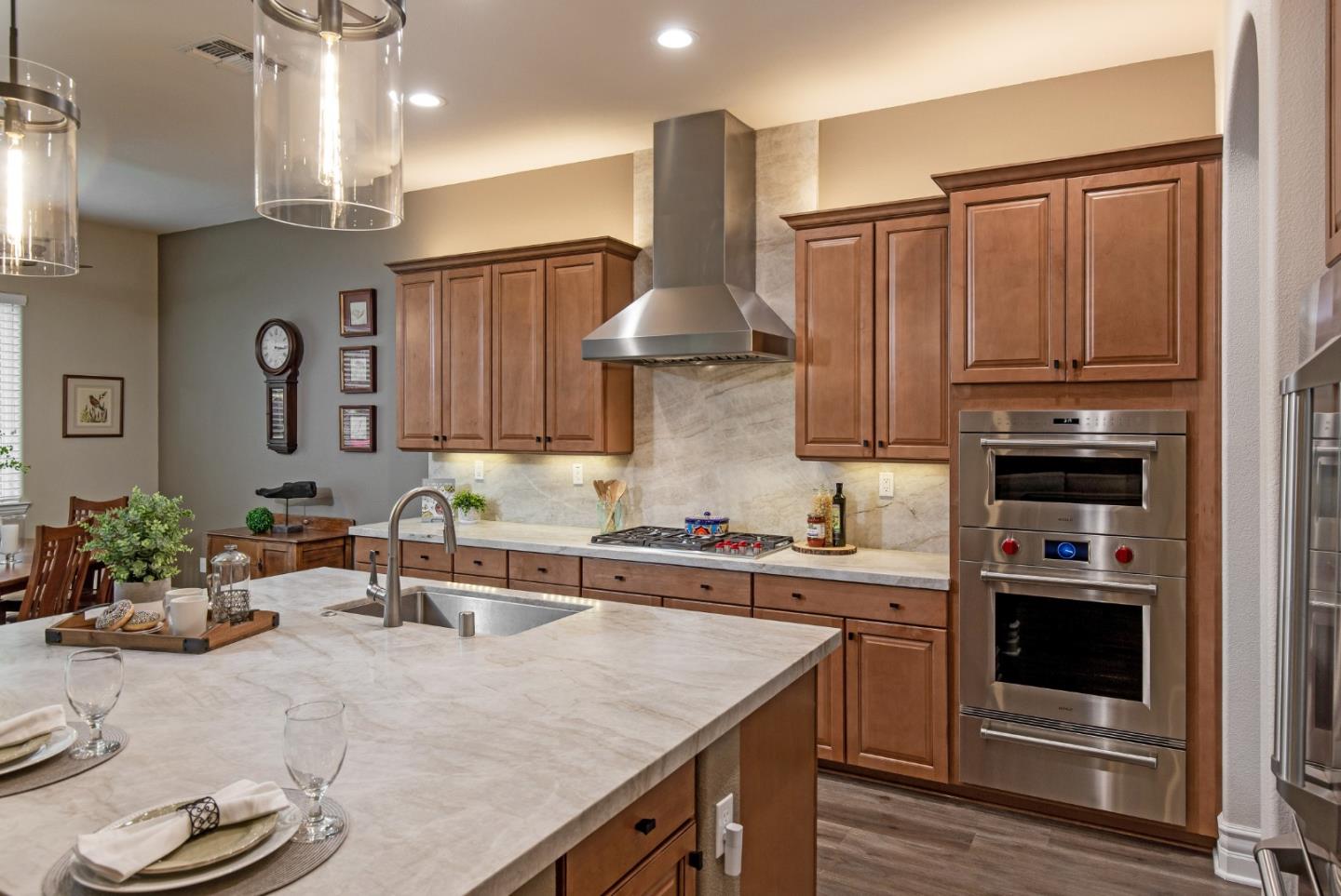 7217 Pitlochry Drive Gilroy, CA 95020 - Photo 10 of 66 a kitchen with stainless steel appliances a sink stove and cabinets