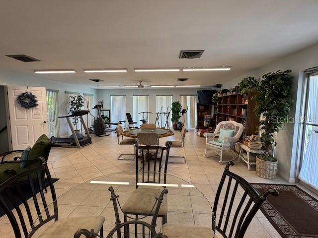11485 Oakhurst Road, Unit 319 Largo, FL 33774 - Photo 52 of 63 a view of a dining room with furniture