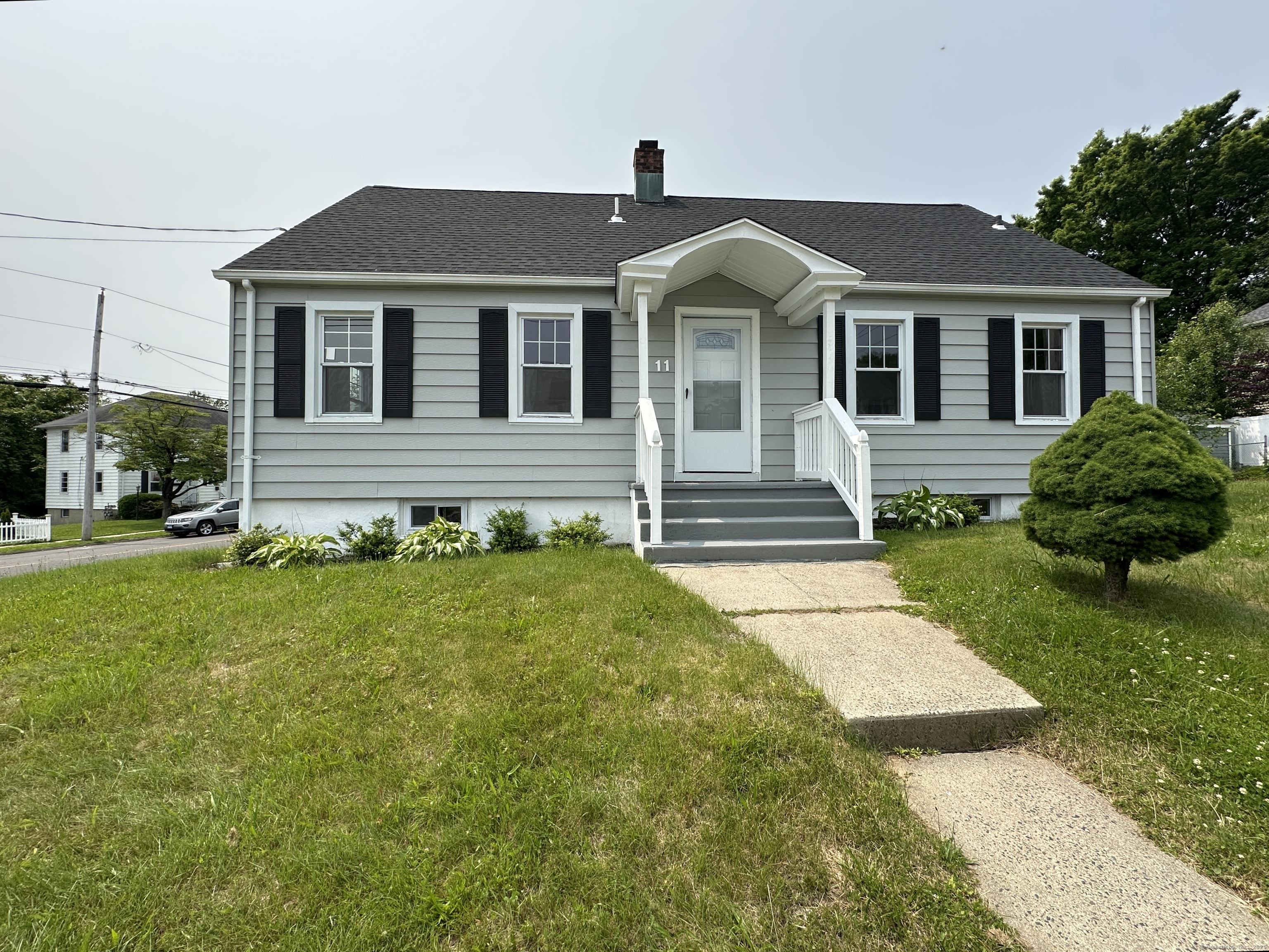 11 Colony Street Stratford, CT 06615 - Photo 1 of 16 a front view of a house with a yard