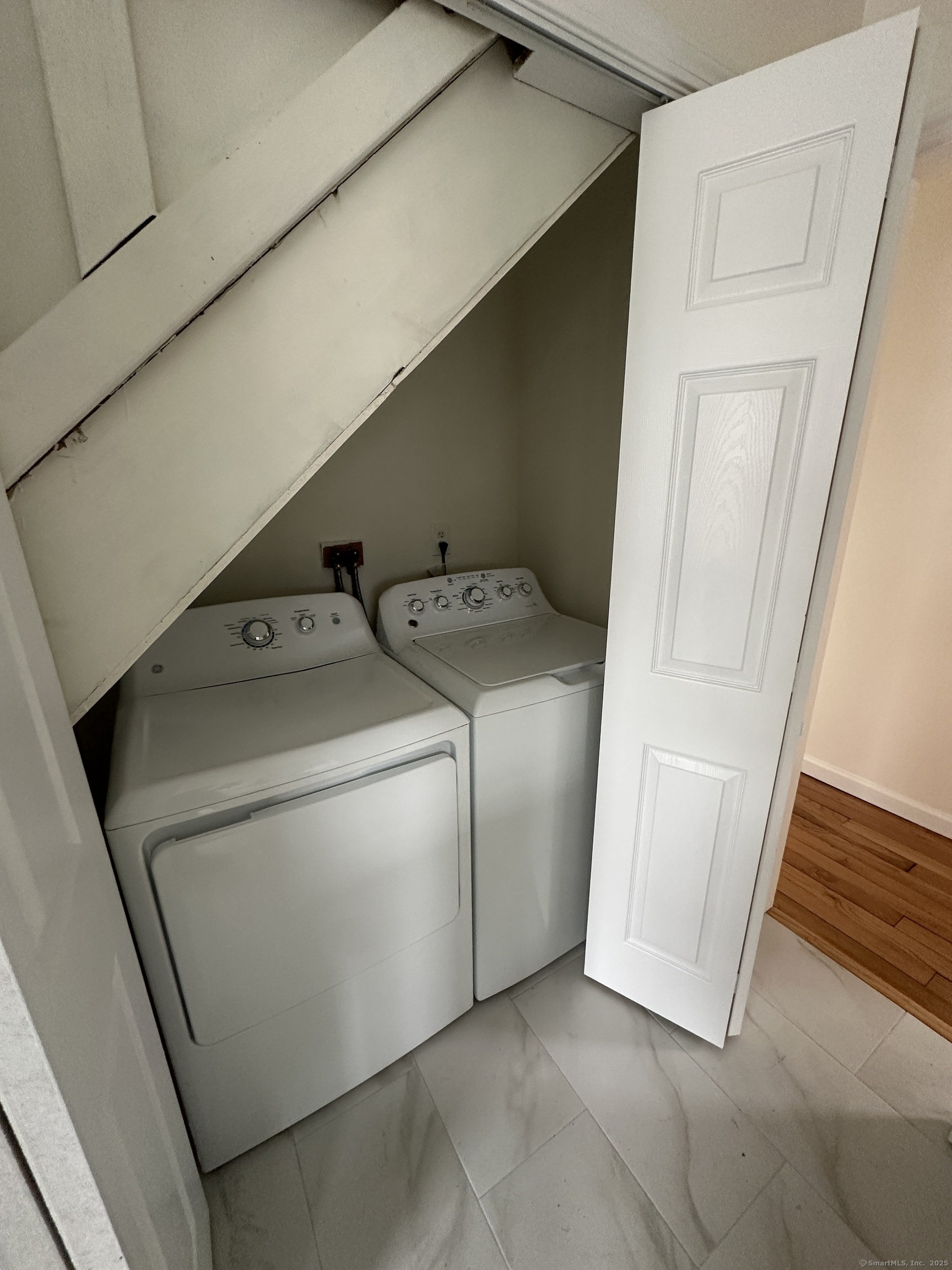 11 Colony Street Stratford, CT 06615 - Photo 11 of 16 a utility room with dryer and washer