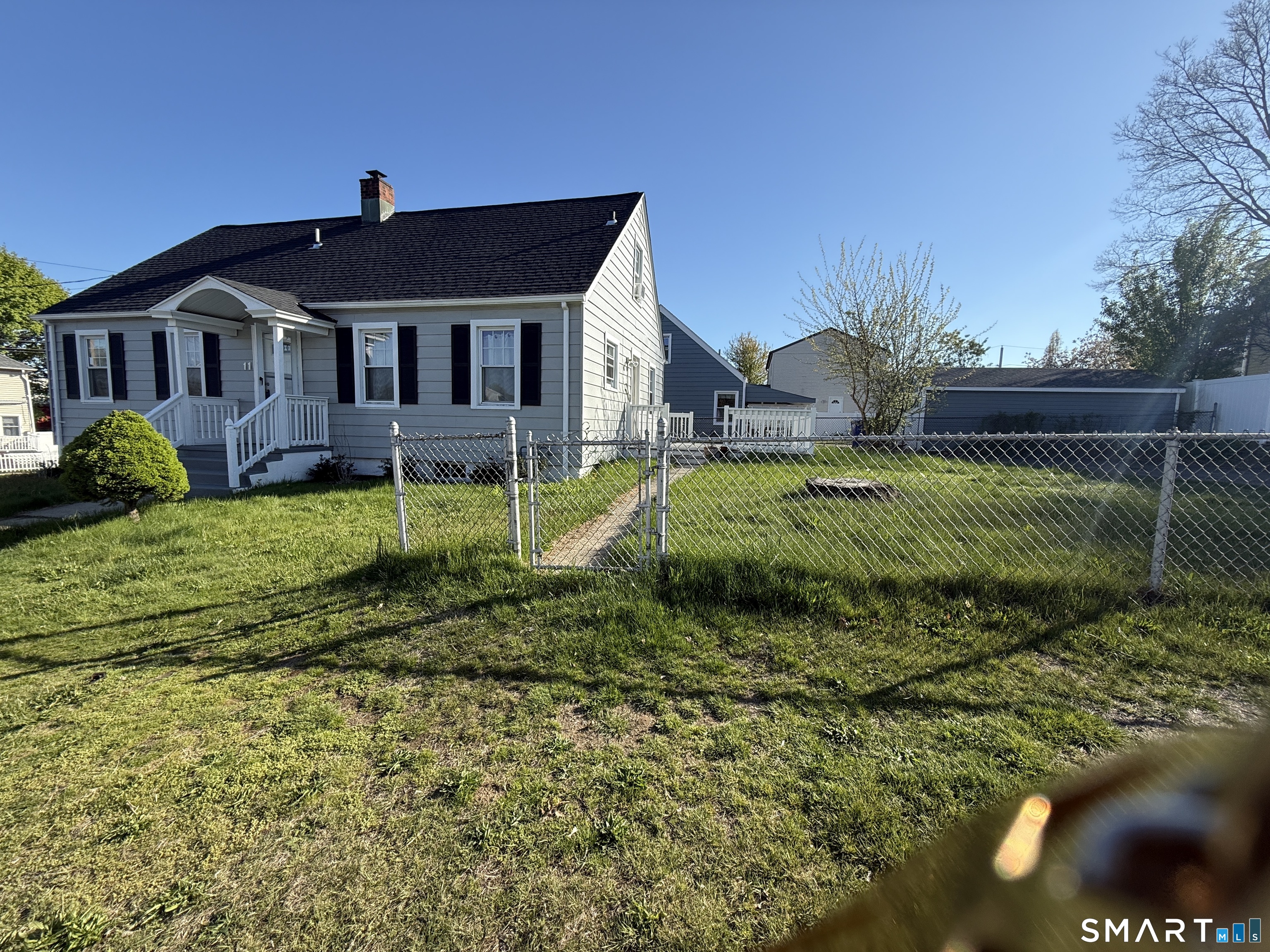 11 Colony Street Stratford, CT 06615 - Photo 3 of 16 a front view of a house with a yard