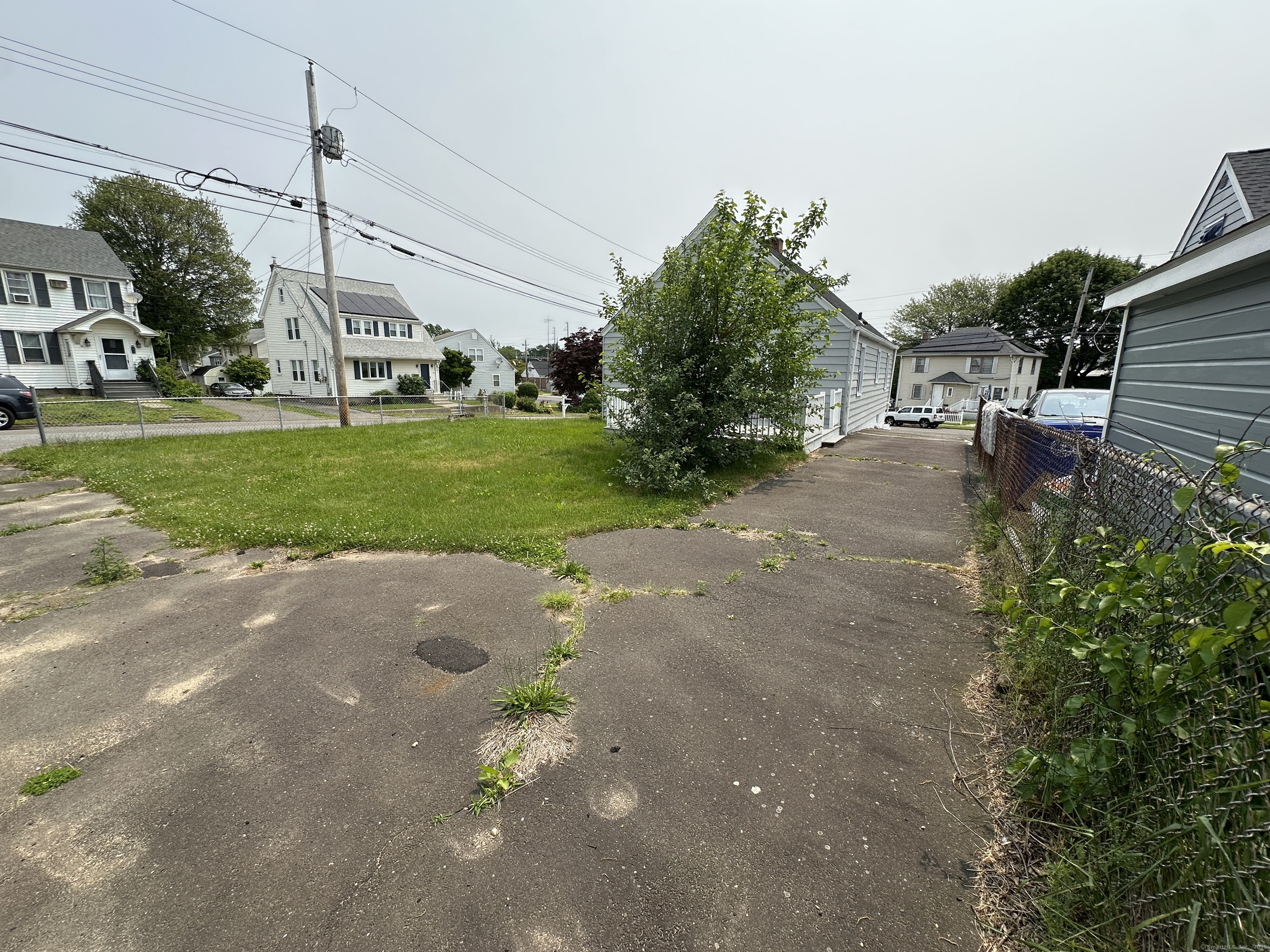 11 Colony Street Stratford, CT 06615 - Photo 5 of 16 a view of a street with houses on both side