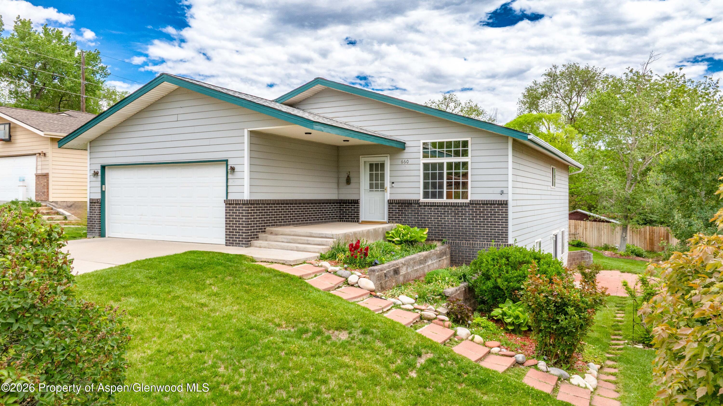 660 Aspen Avenue Rifle, CO 81650 - Photo 4 of 30 a front view of house with yard and green space