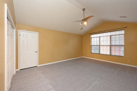 a view of a big room with carpet