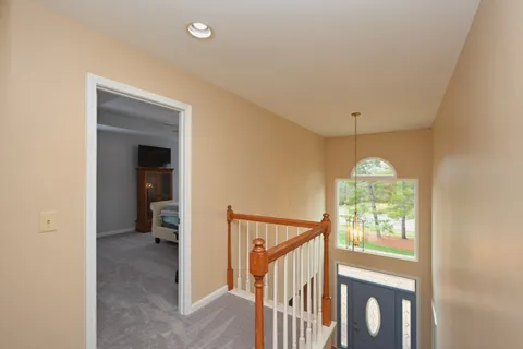 a bedroom with a bed and ceiling fan