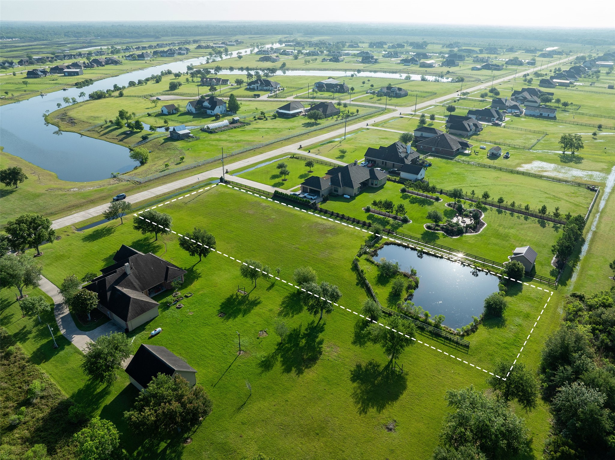 7706 Pebble Hill Lane Rosharon, TX 77583 - Photo 1 of 16 an aerial view of a residential houses with outdoor space and trees