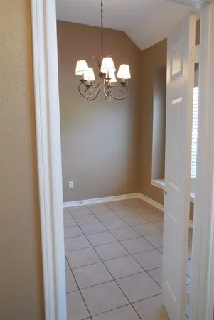a view of a chandelier fan and closet
