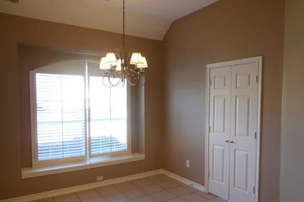 a view of a windows and chandelier in a room