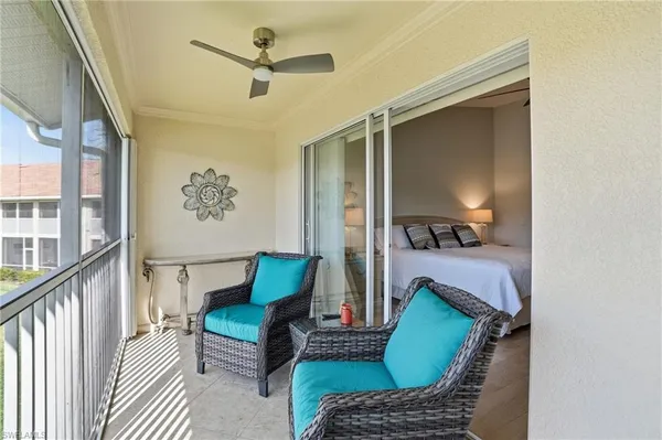 a view of a balcony with furniture