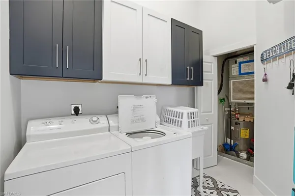 a bathroom with a double vanity sink a mirror a glass door a shower and vanity