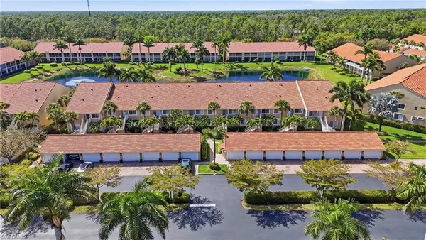 an aerial view of multiple houses with yard