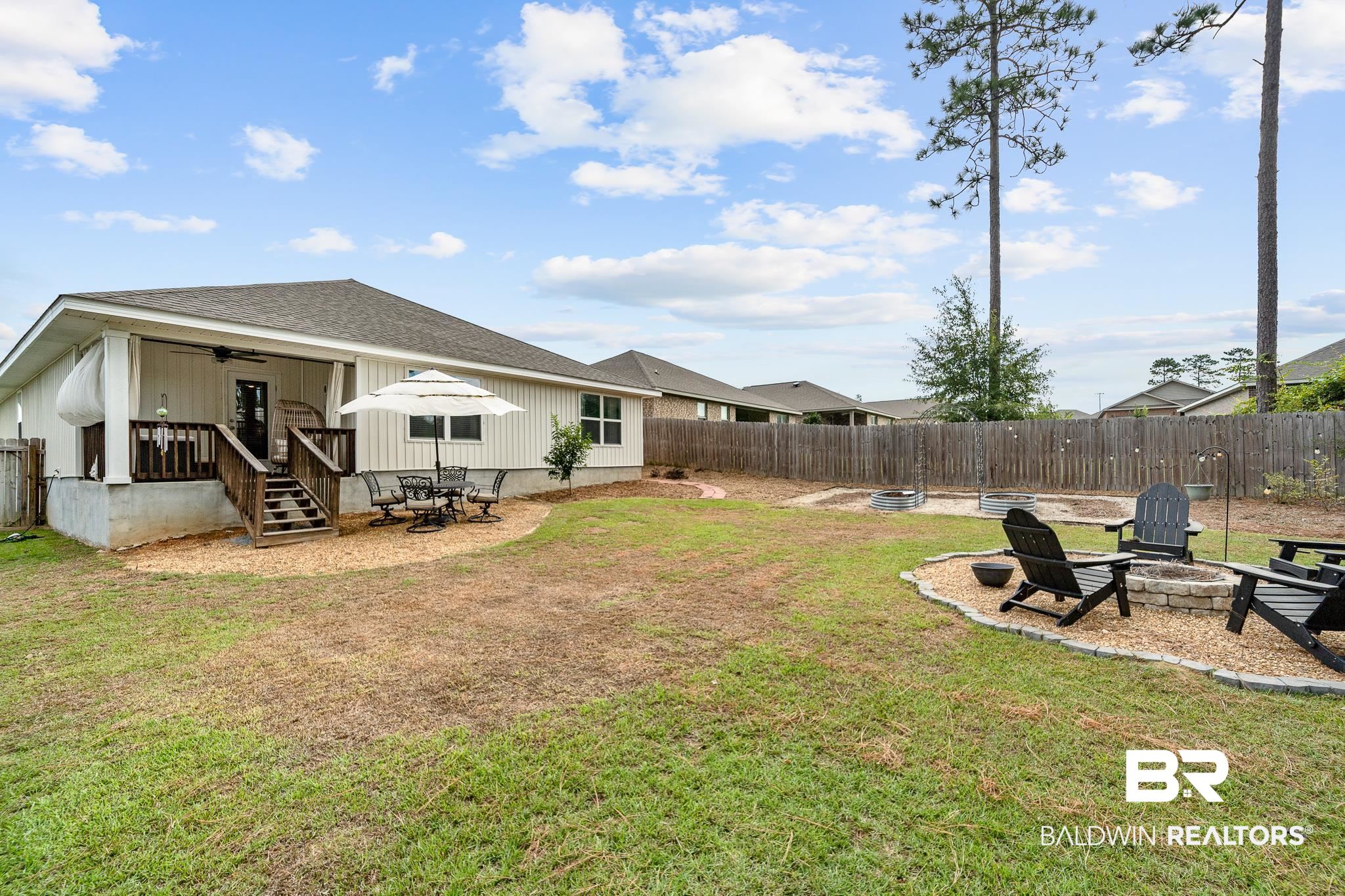 10516 Brodick Loop Daphne, AL 36527 - Photo 25 of 27 View of yard featuring ceiling fan and an outdoor fire pit
