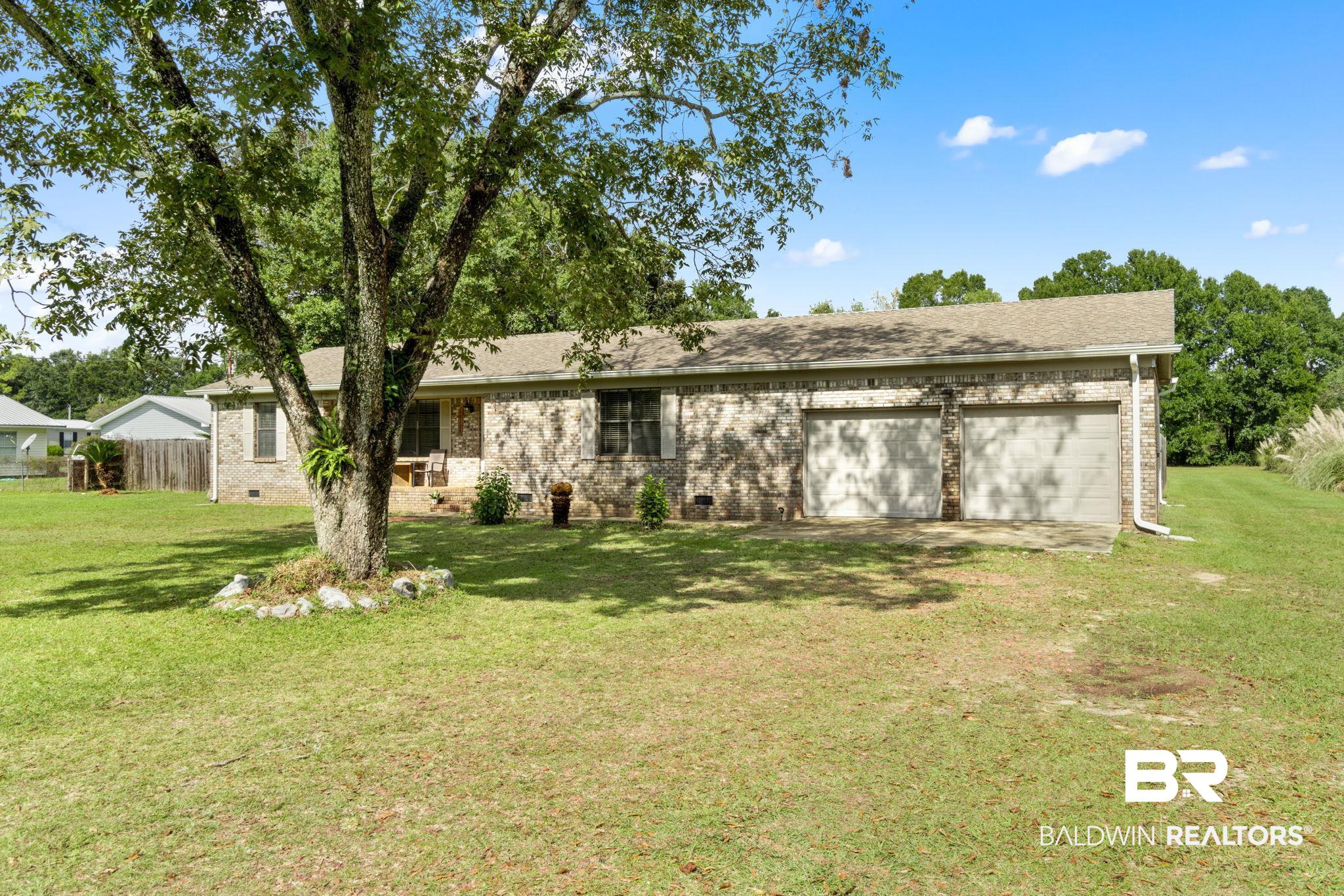 33135 Collier Road Lillian, AL 36549 - Photo 3 of 30 Ranch-style house featuring crawl space, brick siding, a garage, and roof with shingles