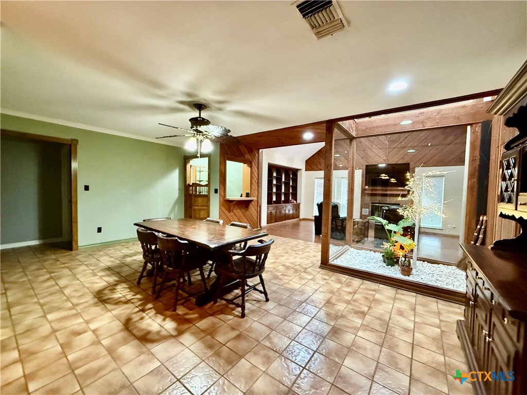 20 Hambleton Road Victoria, TX 77905 - Photo 14 of 42 a living room with a couch and a chandelier