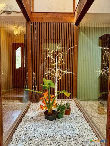 a view of a garden with patio