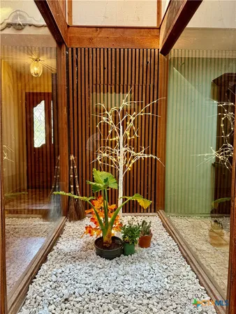 a view of a garden with patio