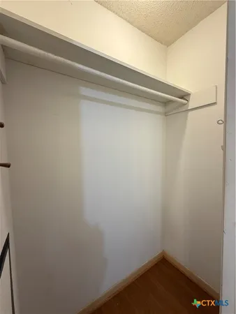 a bathroom with a sink a toilet a mirror and vanity
