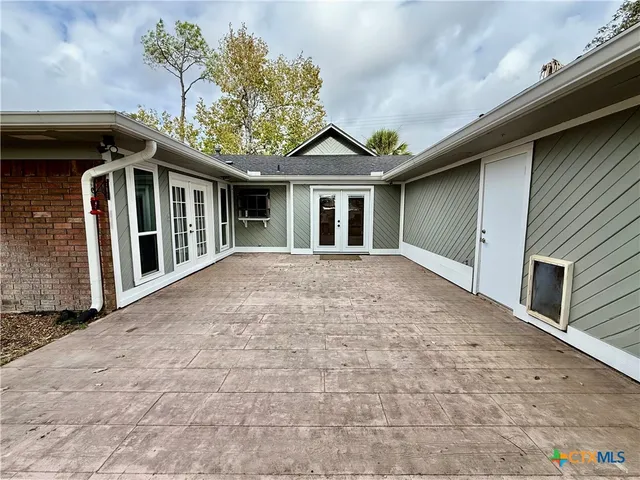 a house with trees in front of it