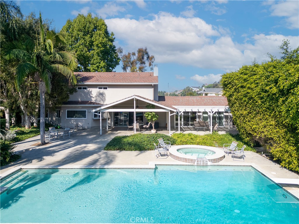 8224 Seranata Drive Whittier, CA 90605 - Photo 1 of 55 a view of a house with swimming pool and a yard