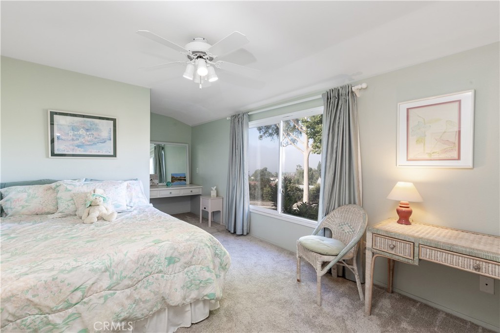 8224 Seranata Drive Whittier, CA 90605 - Photo 11 of 55 a bedroom with a bed and a chandelier