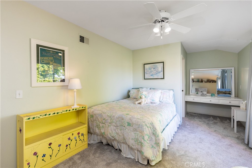 8224 Seranata Drive Whittier, CA 90605 - Photo 12 of 55 a bedroom with a bed and a chandelier