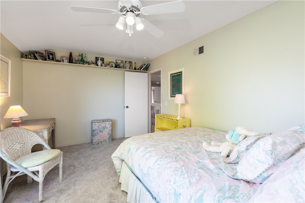 8224 Seranata Drive Whittier, CA 90605 - Photo 13 of 55 a bedroom with a bed and a chandelier