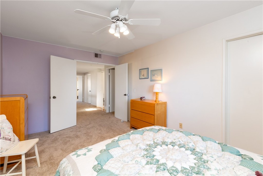 8224 Seranata Drive Whittier, CA 90605 - Photo 15 of 55 a bedroom with a bed and a chandelier