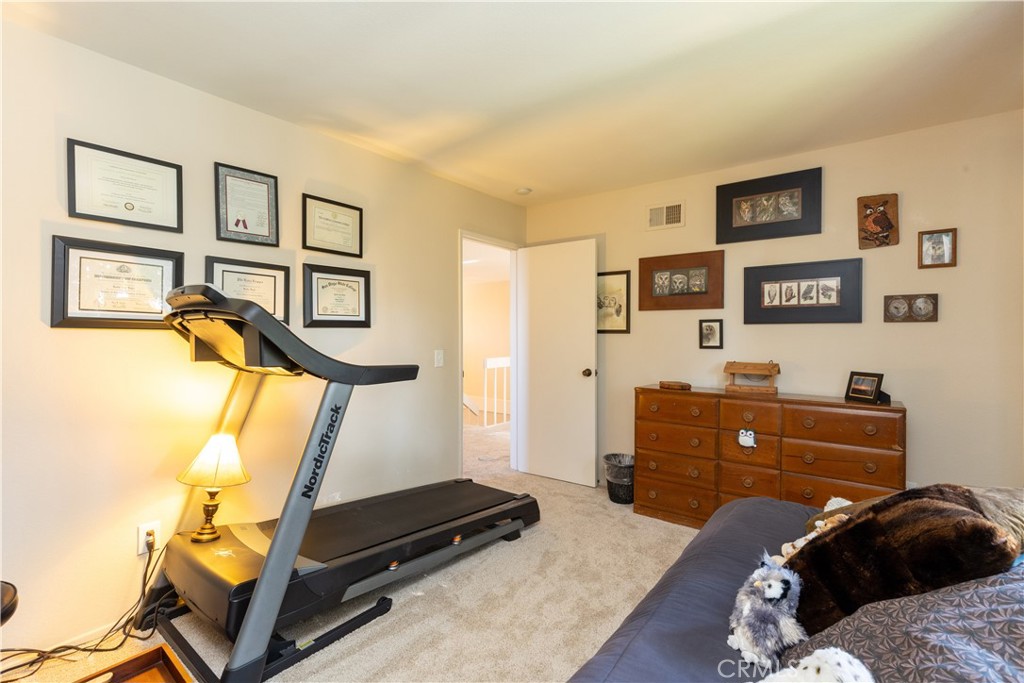 8224 Seranata Drive Whittier, CA 90605 - Photo 17 of 55 a bedroom with a bed and a window