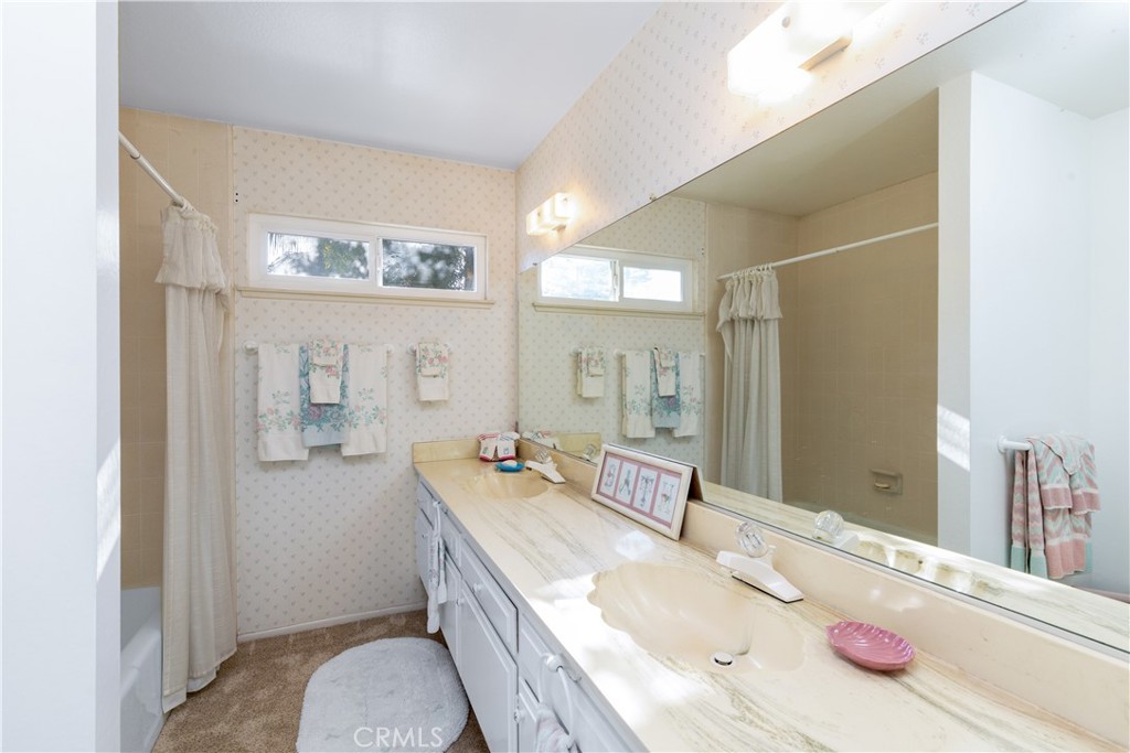 8224 Seranata Drive Whittier, CA 90605 - Photo 18 of 55 a spacious bathroom with a granite countertop tub sink and mirror