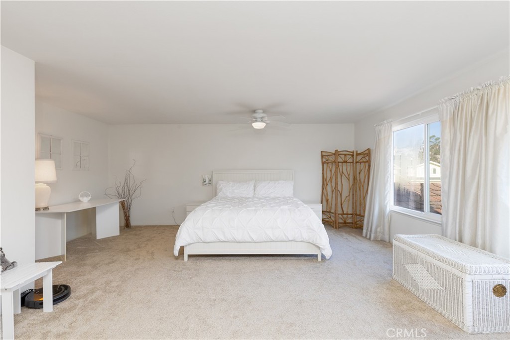 8224 Seranata Drive Whittier, CA 90605 - Photo 19 of 55 a spacious bedroom with a bed and a large window