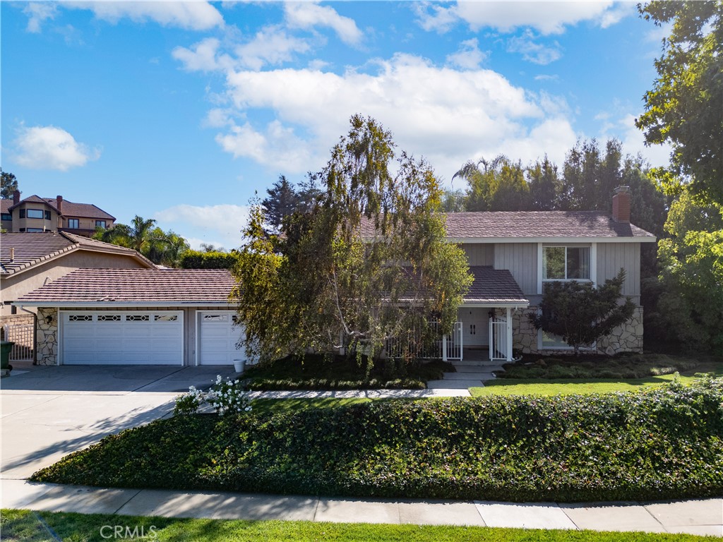 8224 Seranata Drive Whittier, CA 90605 - Photo 2 of 55 a front view of a house with a yard and garage