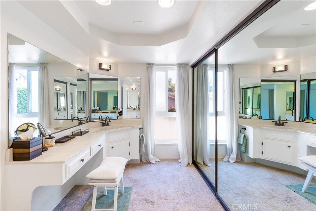 8224 Seranata Drive Whittier, CA 90605 - Photo 22 of 55 a large white kitchen with a large window and stainless steel appliances