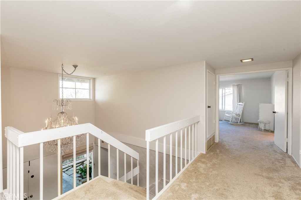 8224 Seranata Drive Whittier, CA 90605 - Photo 26 of 55 a view of a bedroom with wooden floor & windows