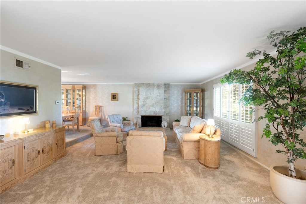 8224 Seranata Drive Whittier, CA 90605 - Photo 27 of 55 a living room with furniture and a fireplace