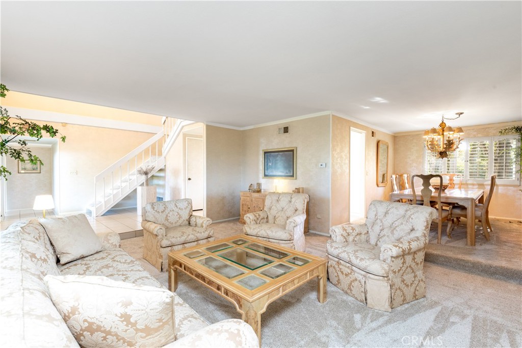 8224 Seranata Drive Whittier, CA 90605 - Photo 29 of 55 a living room with furniture and a table