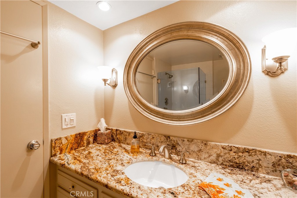 8224 Seranata Drive Whittier, CA 90605 - Photo 37 of 55 a bathroom with a sink and a mirror