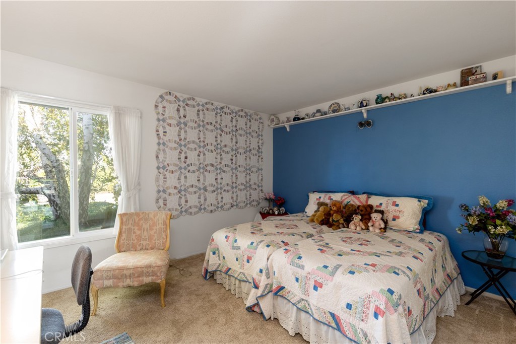 8224 Seranata Drive Whittier, CA 90605 - Photo 39 of 55 a bedroom with a bed and a window